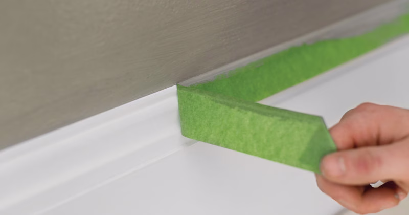 removing painter's tape from baseboard